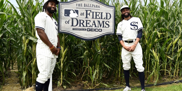 브라이언 굿윈, #18, (엘) and Billy Hamilton, #0 of the Chicago White Sox, pose for a photo while walking through the Field of Dreams movie site prior to the game against the New York Yankees on August 12, 2021 at Field of Dreams in Dyersville, 아이오와.
