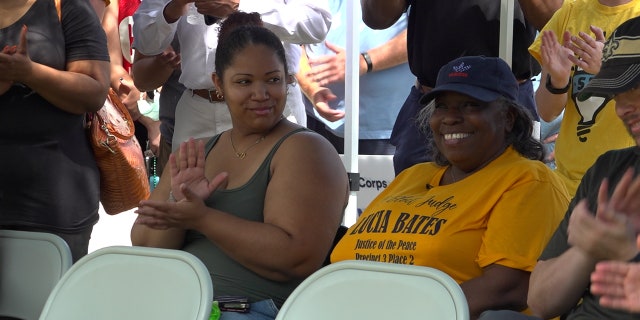 Ms. Claudette and her daughter are recognized by the Saint Bernard Project.