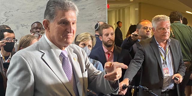 Sen. Joe Manchin, DW.Va., calls a reporter during a press conference on the Democratic reconciliation bill. 