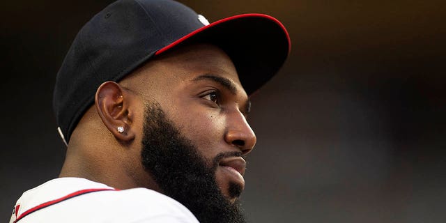 Atlanta Braves Marcell Ozuna watches play from the dugout in the fourth inning of a baseball game against the Houston Astros Saturday, Aug. 20, 2022, in Atlanta.