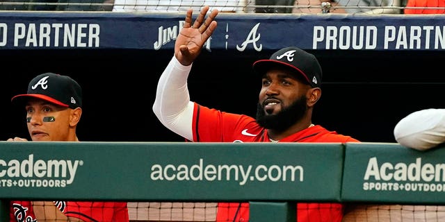 Atlanta Braves' Marcell Ozuna, waves from the dugout during a baseball game against the Houston Astros Friday, Aug. 19, 2022, in Atlanta.