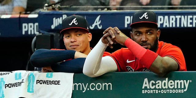 Atlanta Braves' Marcell Ozuna, right and catcher William Contreras (24) watch from the dugout during a baseball game against the Houston Astros Friday, Aug. 19, 2022, in Atlanta.