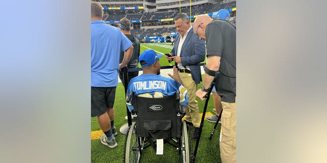 San Bernardino Sheriff's Deputy Marcus Mason, left, and former Pennsylvania Highway Patrol officer Bob Bemis at SoFi Stadium.