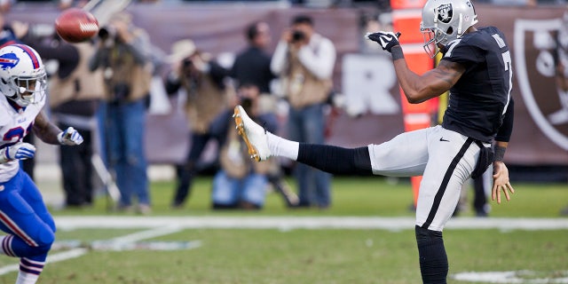 Punter Marquette King, #7 of the Oakland Raiders, sends the ball for 68 yards against the Buffalo Bills late in the fourth quarter on December 4, 2016 at Oakland-Alameda County Coliseum in Oakland, California.