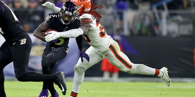 Marquise Brown #5 of the Baltimore Ravens is tackled by Ronnie Harrison Jr. #33 of the Cleveland Browns during a game at M&T Bank Stadium on November 11, 2019. February 28, 2021 in Baltimore, Maryland.