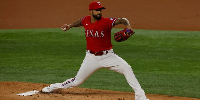 Matt Bush #51 of the Texas Rangers pitches against the Seattle Mariners during the first inning at Globe Life Field on July 15, 2022 in Arlington, Texas. 