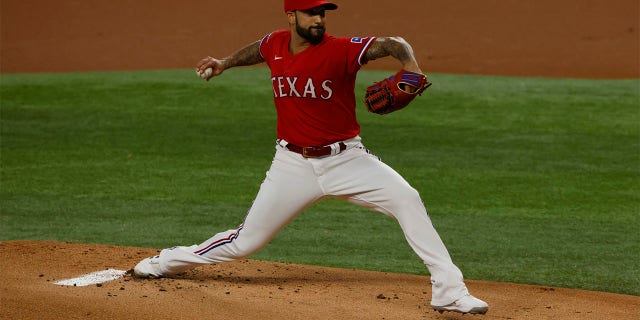 Matt Bush #51 of the Texas Rangers pitches against the Seattle Mariners during the first inning at Globe Life Field on July 15, 2022 in Arlington, Texas.
