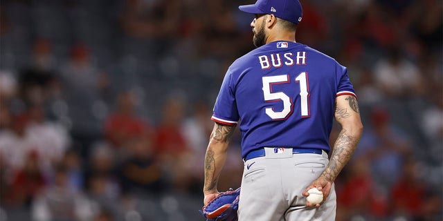 Matt Bush #51 of the Texas Rangers pitches against the Los Angeles Angels during the ninth inning at Angel Stadium of Anaheim on July 29, 2022 in Anaheim, California. (Photo by Michael Owens/Getty Images)