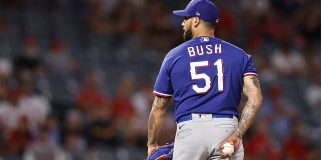Matt Bush #51 of the Texas Rangers pitches against the Los Angeles Angels during the ninth inning at Angel Stadium of Anaheim on July 29, 2022 in Anaheim, California. (Photo by Michael Owens/Getty Images)