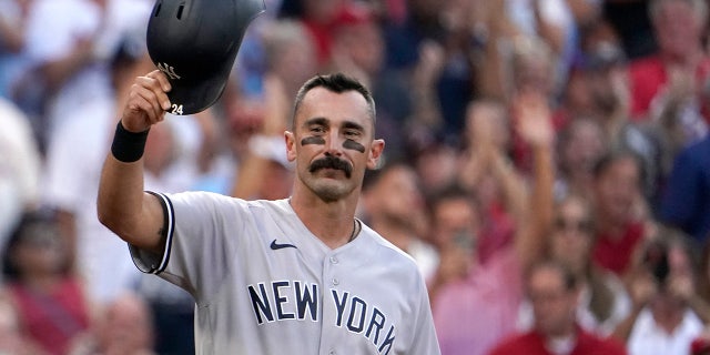 New York Yankees' Matt Carpenter tips his cap as he steps up to bat during the first inning of a baseball game against the St. Louis Cardinals Friday, Aug. 5, 2022, in St. Louis.