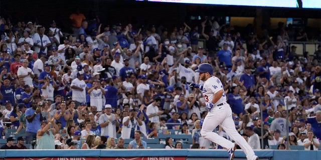 Los Angeles Dodgers' Max Muncy rounds third after hitting a solo home run during the second inning of a baseball game against the Minnesota Twins Wednesday, Aug. 10, 2022, in Los Angeles.