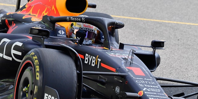 Red Bull driver Max Verstappen raises his fist as he wins at the Spa-Francorchamps racetrack in Belgium, Sunday, Aug. 28, 2022.
