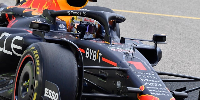 Red Bull driver Max Verstappen raises his fist as he wins at the Spa-Francorchamps racetrack in Belgium, Sunday, Aug. 28, 2022.