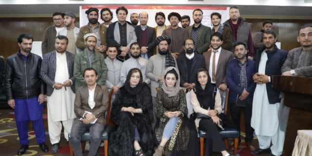 Meena Habib and others pose for picture in December 2021 with the former spokesman of the Ministry of Interior before he was terminated.