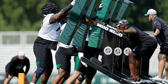 New York Jets guard Mekhi Becton takes part in drills at the NFL football team's training camp in Florham Park, N.J., Thursday, July 28, 2022. 