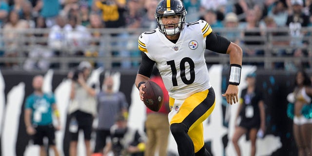 FILE - Pittsburgh Steelers quarterback Mitch Trubisky, 10, battles for yards during the first half of a preseason NFL football game against the Jacksonville Jaguars on Saturday, Aug. 20, 2022 in Jacksonville, Florida.  As replacement for longtime starting quarterback Ben Roethlisberger, who retired in January.