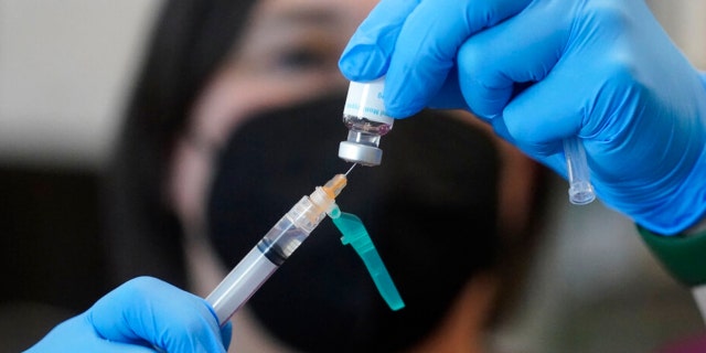 A registered nurse prepares a dose of a monkeypox vaccine at the Salt Lake County Health Department on July 28, 2022, in Salt Lake City. On Aug. 9, 2022, U.S. health officials authorized a new monkeypox vaccination strategy designed to stretch limited supplies by allowing health professionals to vaccinate up to five people — instead of one — with each vial. 