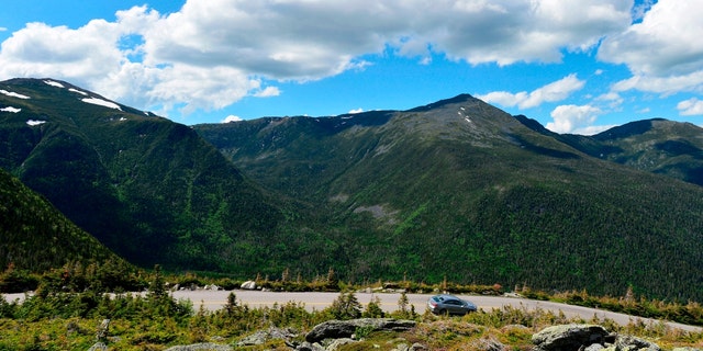 Cars traverse the auto road that leads to the top of Mount Washington, standing at an elevation of 6,288.2 ft in the Presidential Range of the White Mountains in New Hampshire on June 12, 2020. 