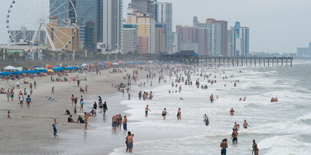 Crowds enjoy the beach on May 29, 2021, in Myrtle Beach, South Carolina.