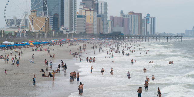 Crowds enjoy the beach in Myrtle Beach, South Carolina, on May 29, 2021.