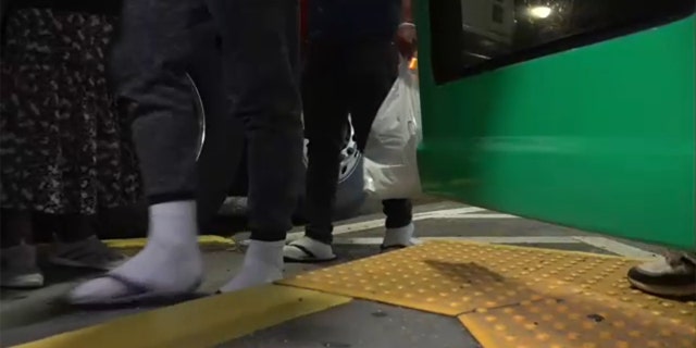 Migrants aboard a bus from Texas arrive in New York City's Manhattan borough, Friday, Aug. 5, 2022.
