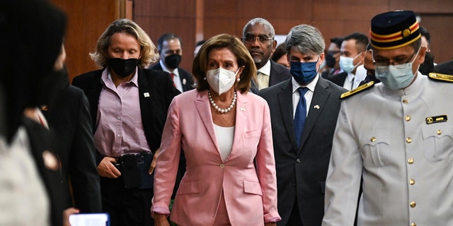 This handout photo taken and released by Malaysia’s Department of Information, U.S. House Speaker Nancy Pelosi, center, tours the parliament house in Kuala Lumpur, Tuesday, Aug. 2, 2022. 