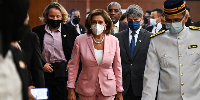 This handout photo taken and released by Malaysia’s Department of Information, U.S. House Speaker Nancy Pelosi, center, tours the parliament house in Kuala Lumpur, Tuesday, Aug. 2, 2022. 