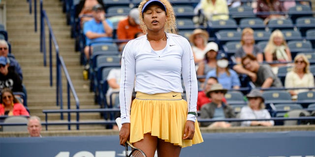 Naomi Osaka reacts during her match against Kaia Kanepi of Estonia during the National Bank Open tennis tournament, Tuesday, Aug. 9, 2022, in Toronto.