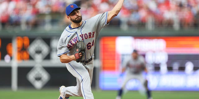 Nate Fisher, #64 of the New York Mets, pitches in the fifth inning during the game between the New York Mets and the Philadelphia Phillies at Citizens Bank Park on Sunday, August 21, 2022 in Philadelphia.