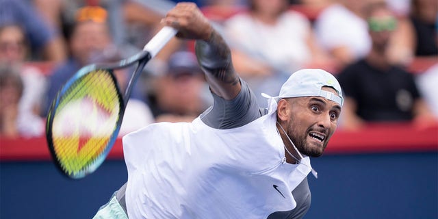 Nick Kyrgios of Australia serves to Daniil Medvedev during second round play at the National Bank Open tennis tournament Wednesday Aug. 10, 2022. in Montreal. 
