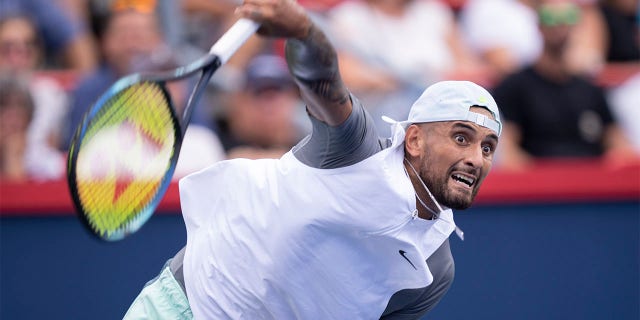 Nick Kyrgios of Australia serves to Daniil Medvedev during second round play at the National Bank Open tennis tournament Wednesday Aug. 10, 2022. in Montreal. 