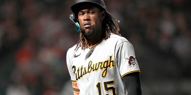 Oneil Cruz #15 of the Pittsburgh Pirates reacts as he walks back to the dugout after striking out against the San Francisco Giants in the top of the ninth inning at Oracle Park on August 13, 2022 in San Francisco, California.