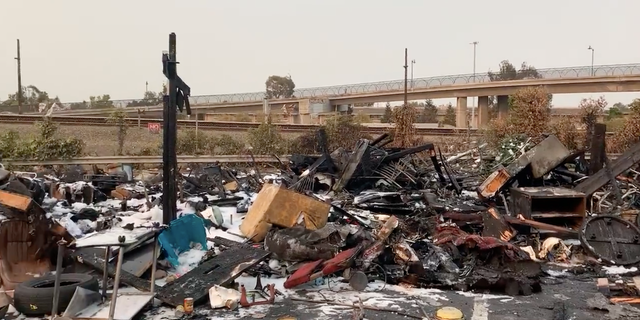 The aftermath of a Wood Hill encampment fire in 2021 in Oakland.