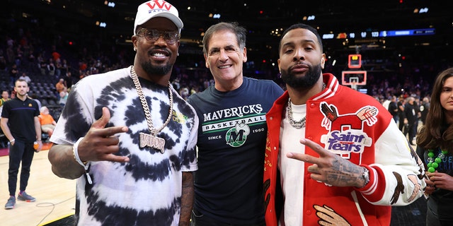 Dallas Mavericks owner Mark Cuban poses with NFL players Von Miller (L) and Odell Beckham Jr. (R) after Game Seven of the 2022 NBA Playoffs Western Conference Semifinals between the Dallas Mavericks and the Phoenix Suns at Footprint Center on May 15, 2022 in Phoenix, Arizona.