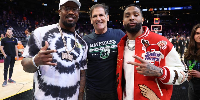 Dallas Mavericks owner Mark Cuban poses with NFL players Von Miller (L) and Odell Beckham Jr. (R) after Game Seven of the 2022 NBA Playoffs Western Conference Semifinals between the Dallas Mavericks and the Phoenix Suns at Footprint Center on May 15, 2022 in Phoenix, Arizona.