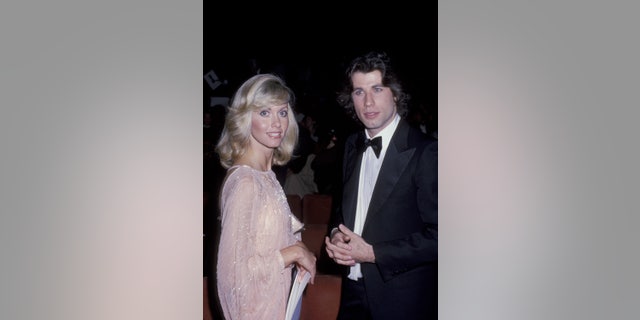 Newton-John and Travolta attend the 50th Annual Academy Awards.