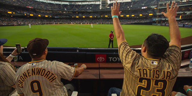 Fans cheer as the San Diego Padres face the Los Angeles Dodgers at Petco Park, Aug. 24, 2021, in San Diego, California.