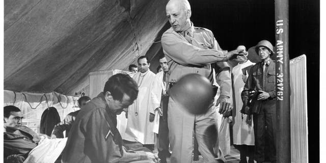 George C. Scott strikes a soldier in a scene from the 1970 film "Patton." Gen. George Patton was charged with slapping two shellshocked soldiers in Sicily during the "Race to Messina."