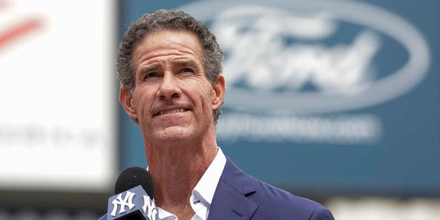 Retired New York Yankees player Paul O'Neill speaks to fans during a number retirement ceremony before a baseball game between the Yankees and the Toronto Blue Jays, Sunday, Aug.  21, 2022, in New York.