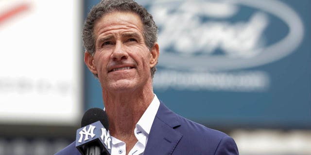 Retired New York Yankees player Paul O'Neill speaks to fans during a number retirement ceremony before a baseball game between the Yankees and the Toronto Blue Jays, Sunday, Aug. 21, 2022, in New York.