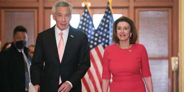 Speaker of the House Nancy Pelosi (R) (D-CA) accompanies Singapore Prime Minister Lee Hsien Loong (L) at the U.S. Capitol March 30, 2022, in Washington, D.C. 