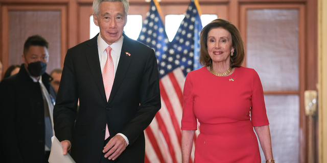 Speaker of the House Nancy Pelosi (R) (D-CA) accompanies Singapore Prime Minister Lee Hsien Loong (L) at the U.S. Capitol March 30, 2022, in Washington, D.C. 