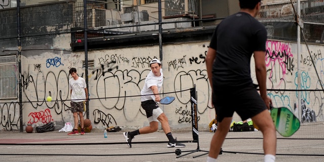 New York City residents participate in a Pickleball game at William F. Passannante Ballfield, in New York City on May 1, 2022.