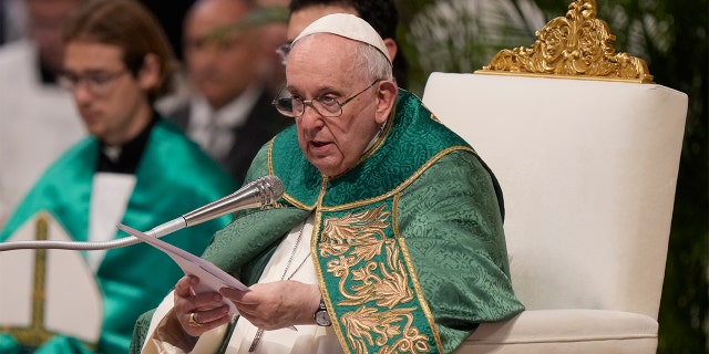 Pope Francis speaks to cardinals in St. Peter's Basilica at The Vatican during a mass he celebrated for the newly created cardinals, Tuesday, Aug. 30, 2022.