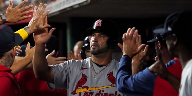 Albert Pujols #5 of the St. Louis Cardinals celebrates scoring a run in the second inning against the Cincinnati Reds at Great American Ball Park on August 29, 2022 in Cincinnati, Ohio.