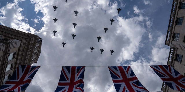 FILE: Royal Air Force aircraft perform a flypast on June 2, 2022, in London, England.