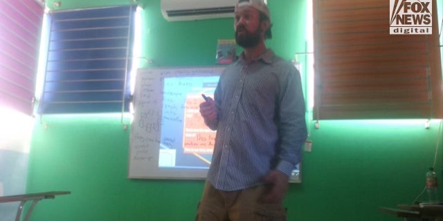 Raymond "RJ" McLeod, the former fugitive accused of murdering his girlfriend Krystal Mitchell in San Diego in 2016, pictured here teaching a class in El Salvador, where he was allegedly laying low as an English instructor while on the U.S. Marshals' Top 15 Most Wanted List until his capture Monday.