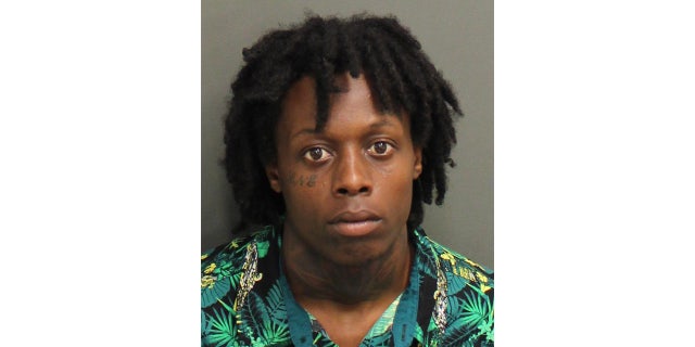 Orlando Police arrested Randall Atwell for allegedly climbing into a Wendy's drive-thru window and stealing the cash drawer while armed.