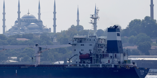 The cargo ship Razoni crosses the Bosphorus Strait in Istanbul, Turkey, on Wednesday, Aug. 3. The first cargo ship to leave Ukraine since the Russian invasion was anchored at an inspection area in the Black Sea off the coast of Istanbul Wednesday morning, awaiting an inspection, before moving on to Lebanon.