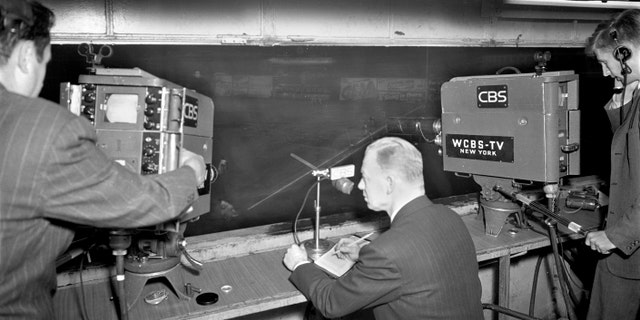 CBS Radio sports announcer Red Barber gets ready to broadcast a baseball game over CBS television — Brooklyn Dodgers vs. Boston Braves, at Ebbets Field, a night game, which was postponed by rain, May 14, 1948.